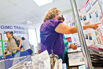Etheline Morgan checks out the displays during Trauma Awareness Day at Gallup Indian Medical Center Thursday.© 2011 Gallup Independent / Cable Hoover 